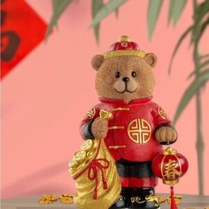 Festive Bear Figurine with Lantern and Gold Bag